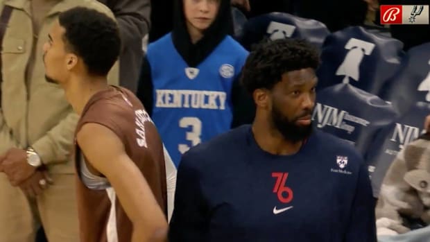Joel Embiid reacts to seeing Victor Wembanyama warm up ahead of a game.